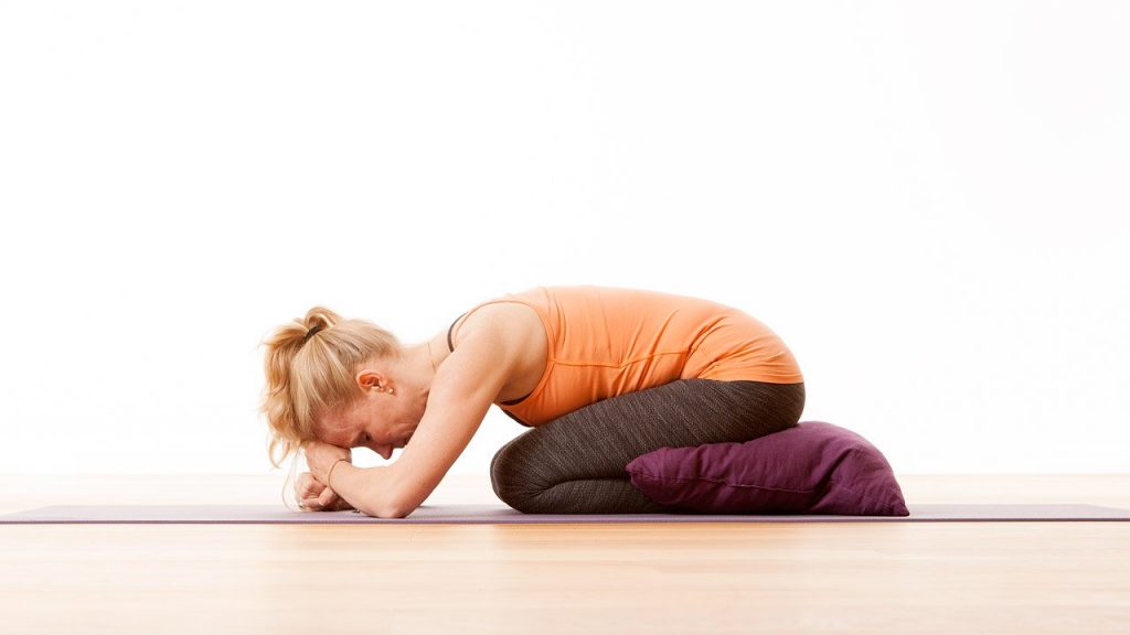 Balasana with head and hips supported