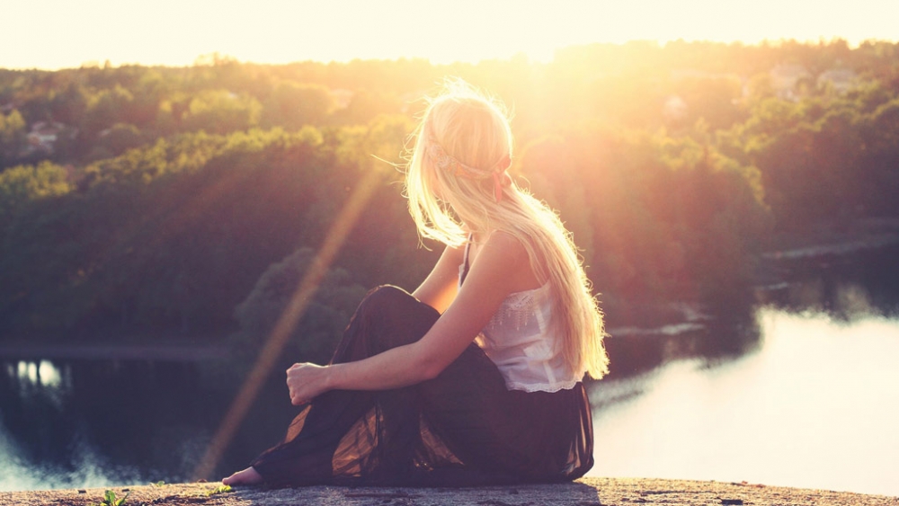 Girl overlooking lake view