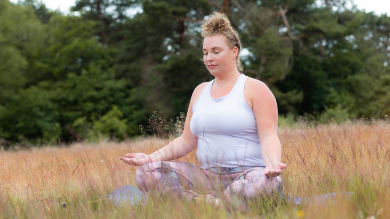 Woman outside doing Loving Kindness Meditation