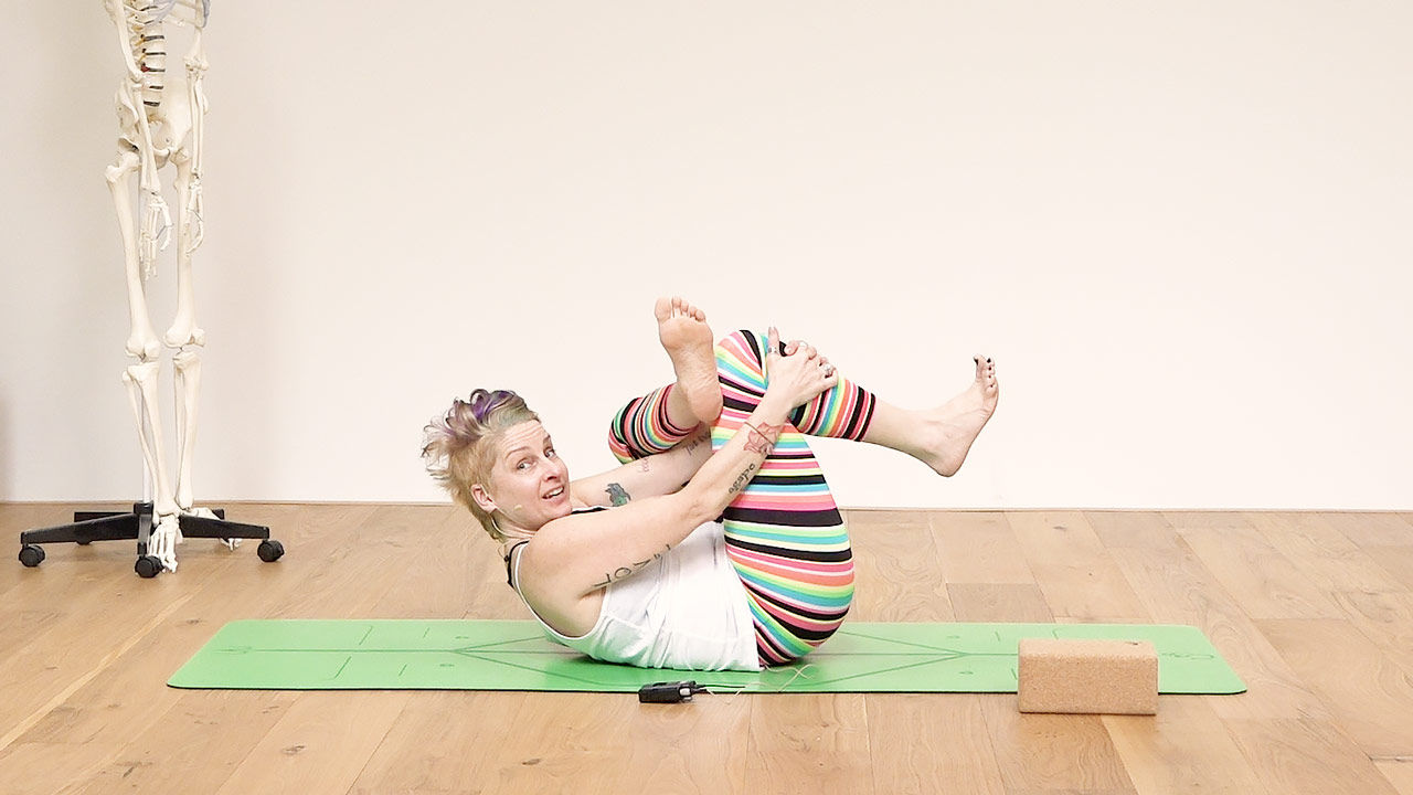 Jennilee Toner in figure 4 yoga pose
