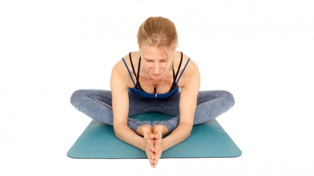 Esther in Butterfly pose to balance the svadhisthana chakra