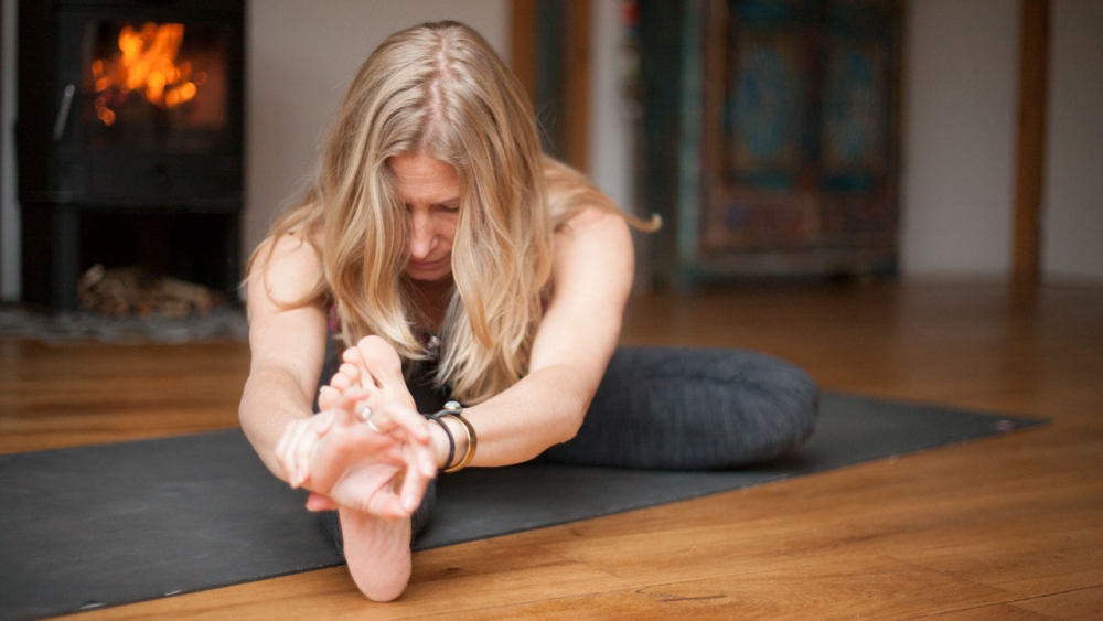 brahmacharya Esther Ekhart in Janu Sirsasana forward fold