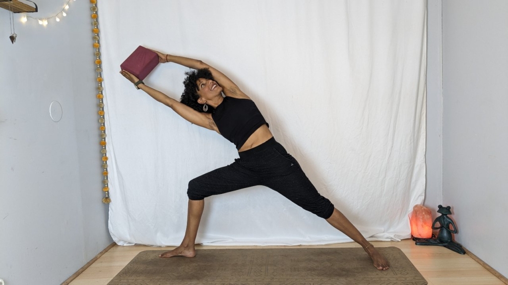 Extended Side Angle pose holding block between hands