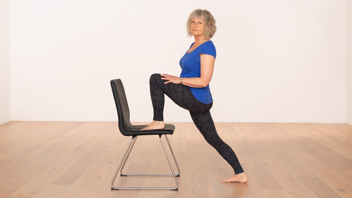 Lunge pose with a chair