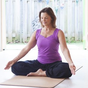 Woman in meditation with hand mudra